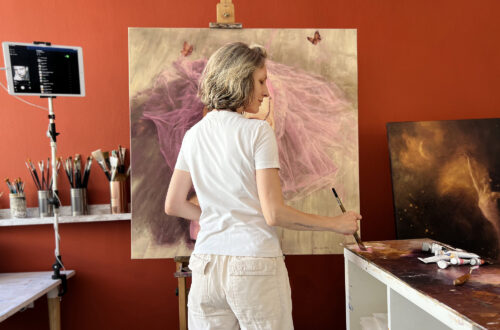 Artist Alexandrina Karadjova in her studio painting